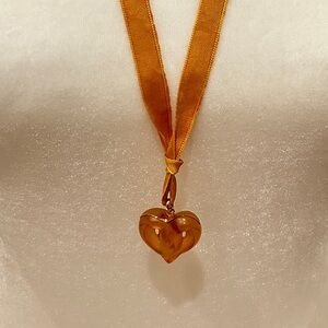 Lalique Amber color heart necklace.